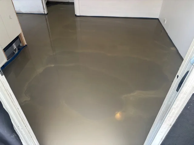 Specialist carrying out subfloor rectification ahead of timber installation