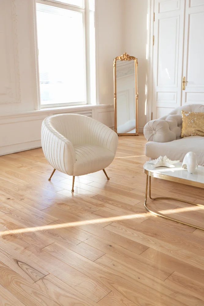 Elegant Hornsby living room with light timber flooring and white furnishings